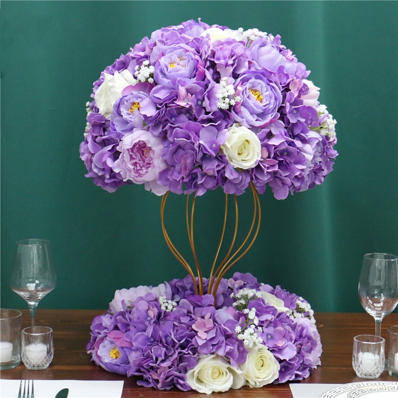 Arranging and attaching the flowers to the wall